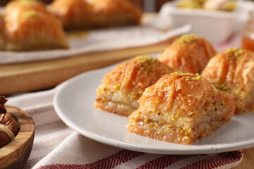 Delicious sweet baklava with pistachios on table, closeup