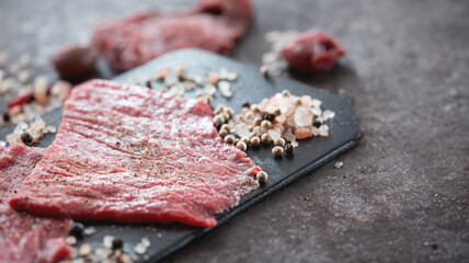 Thinly sliced beef and salt and pepper