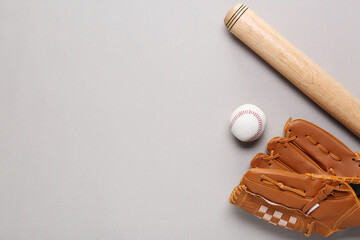 Baseball glove, bat and ball on light grey background, flat lay. Space for text
