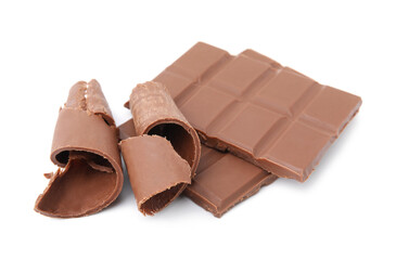 Pieces of tasty chocolate bar and shavings isolated on white