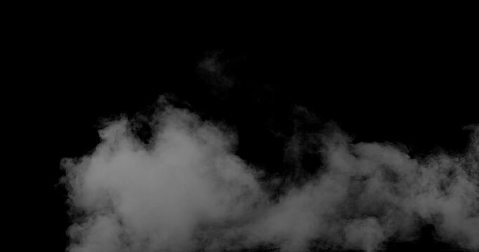 Strong white smoke on the black background