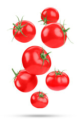 Fresh ripe tomatoes falling on white background