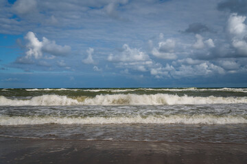 View of the incoming wave on the Baltic Sea on the shore of the Curonian Spit on a summer day, Kaliningrad region, Russia
