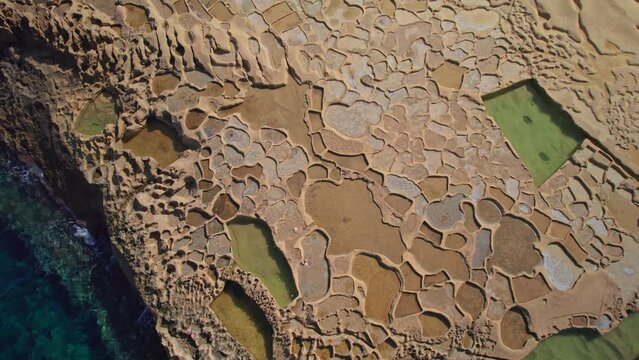 Dynamic Aerial Over Salt Pans on Coast of Gozo Island, Malta