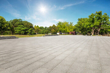 .Empty tiles floor at the nice and peaceful comfortable great nature park panorama... - obrazy, fototapety, plakaty