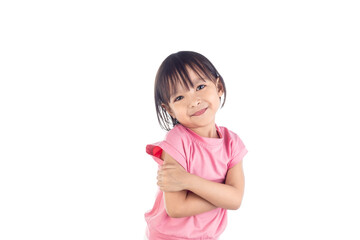 Cute Asian girl standing with her arms crossed and smiling Isolated on white background with clipping path.