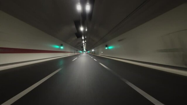 POV fast car driving in tunnel on the highway, 4k