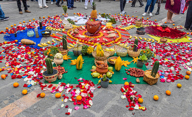Chakana (Chacana) is an ancient spiritual ceremony around the Andean cross of indigenous of the central Andes. The cross is created from plants, food, seeds. Ecuador, Cuenca - obrazy, fototapety, plakaty