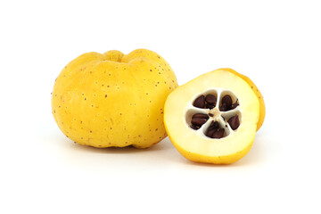 Halved quince with seeds visible over white background