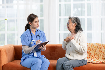 Asian doctor woman visited senior or elderly patient to diagnosis and check up health at home.Happy...