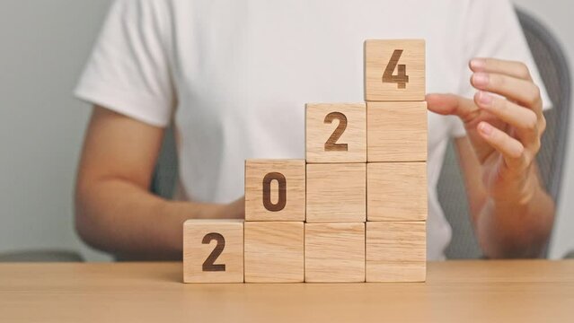 2024 wood block with business goal, success, strategy, target, mission, action, growth, teamwork, plan, idea and New Year start concept
