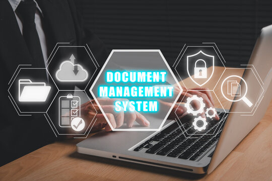Document management system concept, Businessman using laptop computer with cocument management system icon on virtual screen.