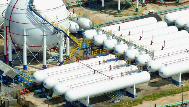 A panoramic view from above reveals the intricate network of natural gas storage, where industrial giants safeguard energy for the future. Natural gas: Key to industrial growth.
