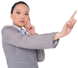 Papier Peint photo Lieux asiatiques Digital png photo of focused asian businesswoman pointing with finger on transparent background