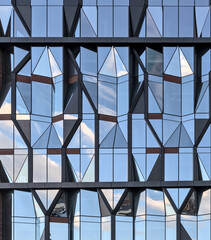 unique reflective glass building (modern architecture reflecting the sky) brooklyn abstract tower in dumbo (windows, high rise, skyscraper, cold style) angular distinctive diamond shaped window 