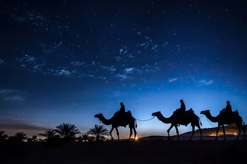 Foto op Plexiglas Silhouette of the three wise men traveling on camels to Bethlehem for the birth of baby Jesus © Sattawat