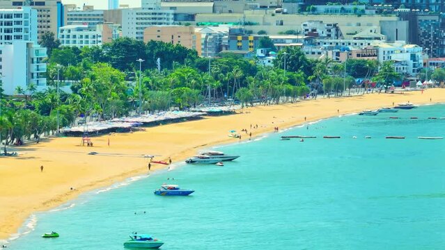 A renowned global beach destination, vibrant entertainment hubs, and a plethora of water activities. An abundance of services, from dining to shopping. Pattaya Beach, Thailand. Aerial view drone.
