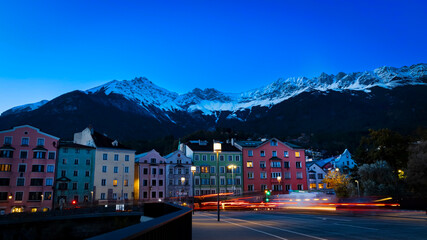 The long exposure night view in Innsbruck  as city center town with beautiful houses, river Inn and...