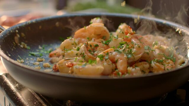 Fresh Shrimp Cooking in a Steaming Skillet on Stove