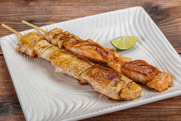 Grilled salmon skewer with sauce