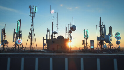 Rooftop base station at sunset covered with telecom tower antenna with graphics of broadcasting...