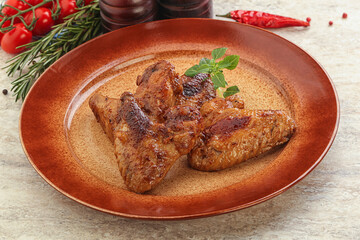 Roasted chicken wings with spicy sauce