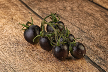 Ripe tasty black cherry tomato