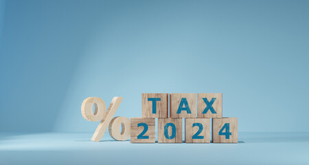 Tax wooden letter and 2024 number on wooden block. Pay tax in 2024 years. tax concept. Income tax...