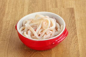 Marinated squid strips in the bowl