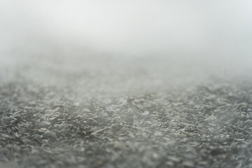 gravel texture floor with mist or fog. Light, dark and gray abstract gravel texture for display products