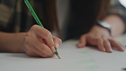 Engineer hands drawing sketch closeup. Asian designer girl working blueprints