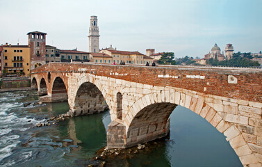 Fototapeta na wymiar Verona - Pietra bridge - Ponte Pietra and Duomo tower and San Giorgio church in background