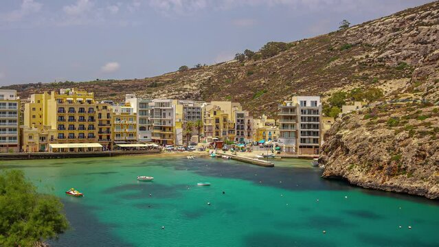 Xlendi, Gozo, Malta, timelapse. Mediterranean coastal landscape surrounded by cliffs and valley. Place for swimming, sunbathing and diving
