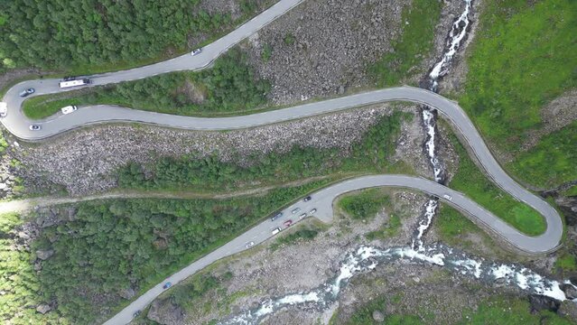 Trollstigen Mountain Road in Norway - Cars driving touristic route with hairpin turns