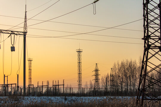 Electric poles at sunset in winter