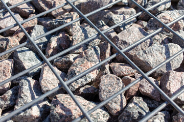 Stones under a metal grate. Background