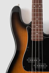 Black bass guitar on white background. Musical instrument
