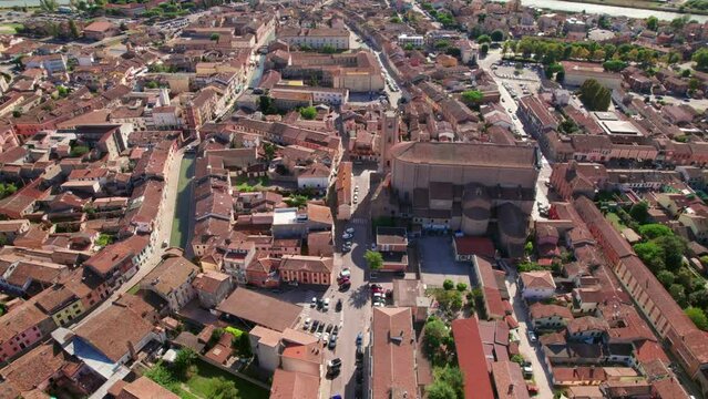 Comacchio Cathedral, Italy, drone  orbit view of urban infrastructure, little Italian city, sunny weather