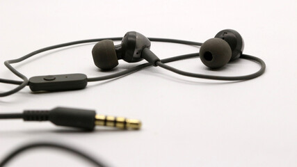 Close up of black wired earphones