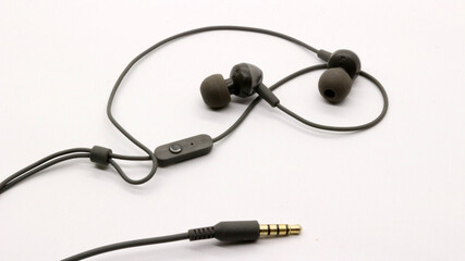 Close up of black wired earphones