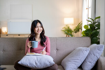 Obraz premium Woman spend time at home seated on sofa