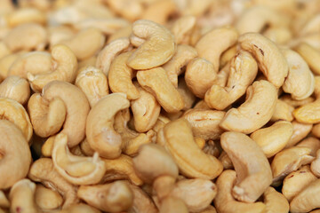 Close-up of cashew nuts background. Healthy food and nutrition concept.