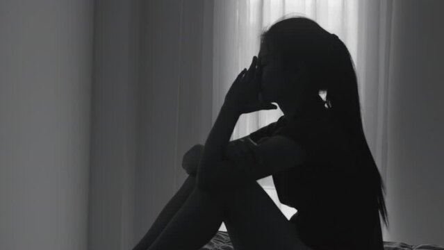 Silhouette  video of man and woman arguing in bedroom, family crisis Domestic Violence, Concept of Stop Violence Against Women,  Woman Victim of Violence.