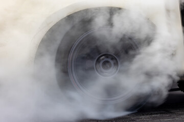 Drag car burning tire, Warm up tire before competition, Drag car wheel, Spinning wheel and smoke,...