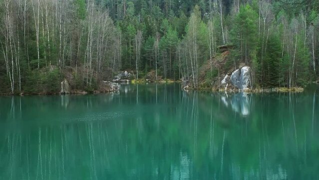 Beautiful lake landscape with reflection in springtime, 4k