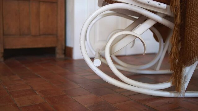 White vintage rocking chair inside domestic home, close up view
