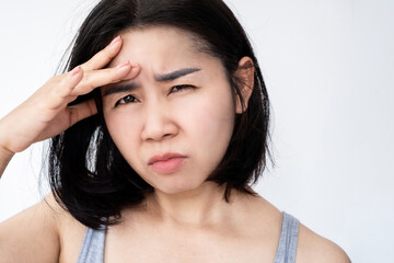 light sensitivity , photophobia, eye blurry concept with Asian woman forcing to watch or difficult...