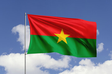 Burkina Faso flag fluttering in the wind on sky.