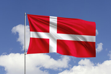 Denmark flag fluttering in the wind on sky.