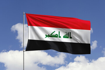 Iraq flag fluttering in the wind on sky.